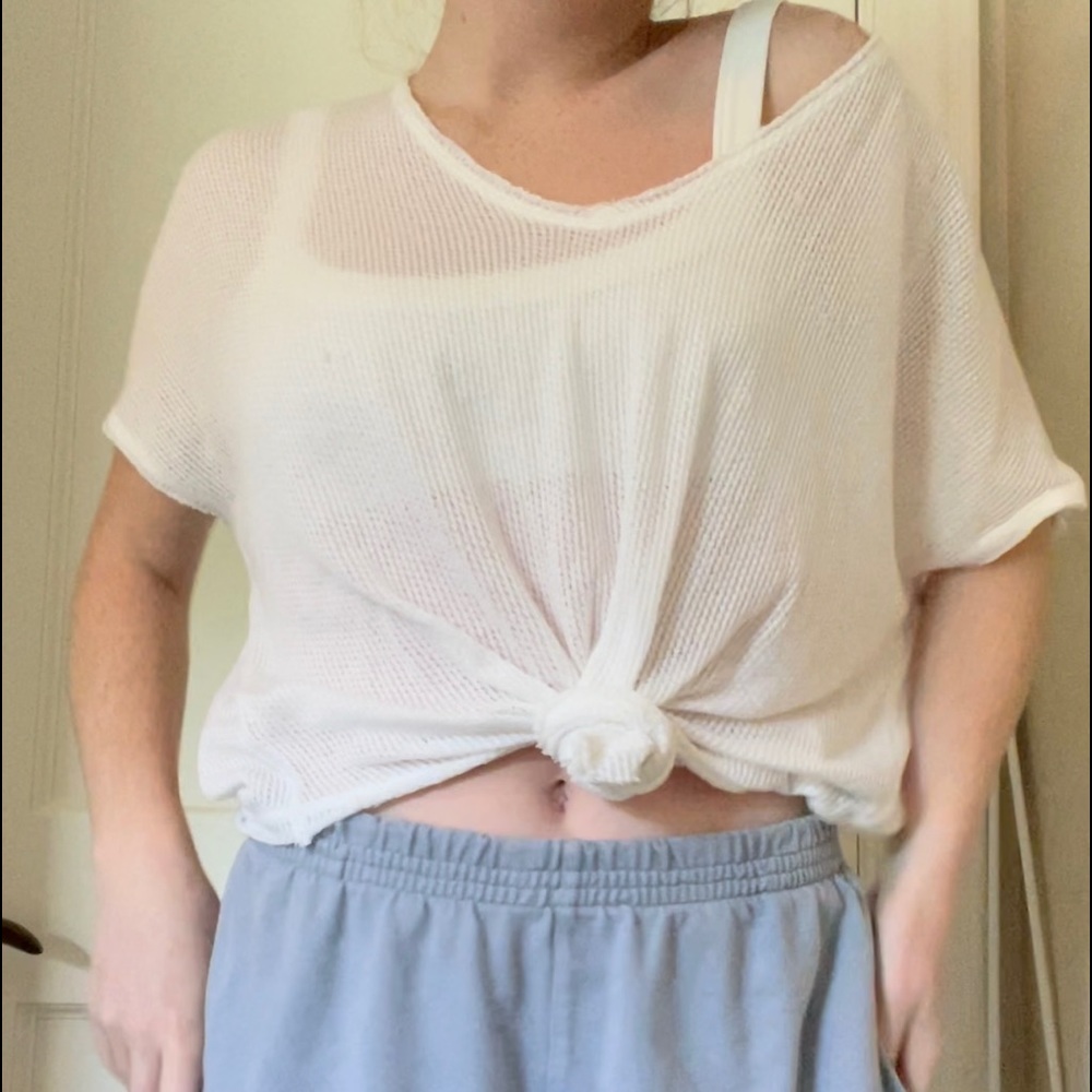 Out From Under Urban Outfitter’s White Top